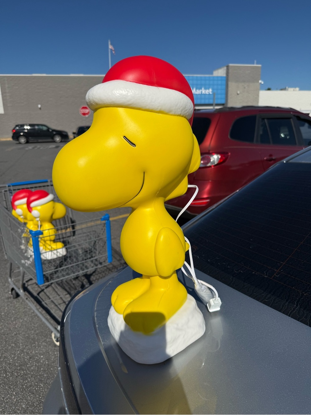 Yellow Woodstock Holiday Figurine with Red Santa Hat